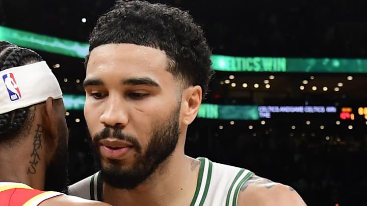 Mar 27, 2026; Boston, Massachusetts, USA; Atlanta Hawks guard Nickeil Alexander-Walker (7) and Boston Celtics forward Jayson Tatum (0) after a game at TD Garden. Mandatory Credit: Bob DeChiara-Imagn Images
