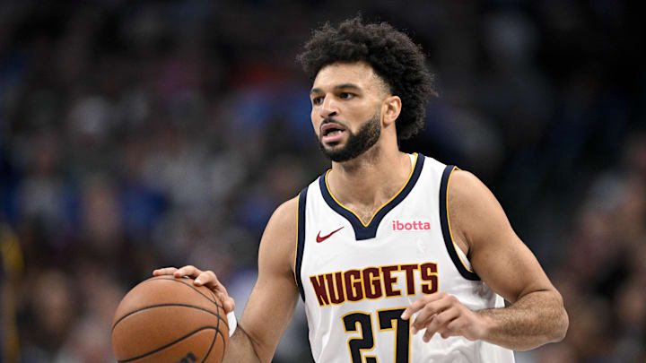 Dec 23, 2025; Dallas, Texas, USA; Denver Nuggets guard Jamal Murray (27) brings the ball up court during the game between the Mavericks and the Nuggets at the American Airlines Center.