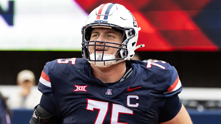 Nov 22, 2025; Tucson, Arizona, USA; Arizona Wildcats offensive lineman Ty Buchanan (75) against the Baylor Bears at Casino Del Sol Stadium. Mandatory Credit: Mark J. Rebilas-Imagn Images Nov 22, 2025; Tucson, Arizona, USA; Arizona Wildcats offensive lineman Ty Buchanan (75) against the Baylor Bears at Casino Del Sol Stadium. Mandatory Credit: Mark J. Rebilas-Imagn Images