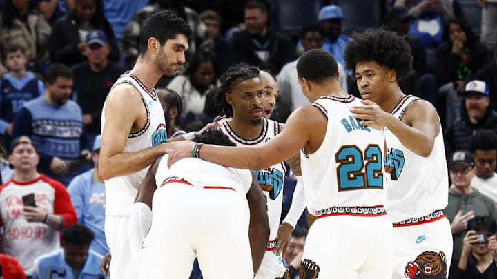 Dec 23, 2024; Memphis, Tennessee, USA; Memphis Grizzlies forward Santi Aldama (7), forward Jaren Jackson Jr. (13), guard Ja Morant (12), guard Desmond Bane (22) and forward Jaylen Wells (0) huddle during the fourth quarter against the Los Angeles Clippers at FedExForum. Mandatory Credit: Petre Thomas-Imagn Images Dec 23, 2024; Memphis, Tennessee, USA; Memphis Grizzlies forward Santi Aldama (7), forward Jaren Jackson Jr. (13), guard Ja Morant (12), guard Desmond Bane (22) and forward Jaylen Wells (0) huddle during the fourth quarter against the Los Angeles Clippers at FedExForum. Mandatory Credit: Petre Thomas-Imagn Images