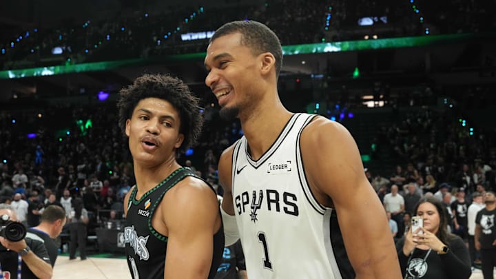 May 15, 2026; Minneapolis, Minnesota, USA; San Antonio Spurs forward Victor Wembanyama (1) talks with Minnesota Timberwolves forward Joan Beringer (19) after game six of the second round of the 2026 NBA Playoffs at Target Center. Mandatory Credit: Jesse Johnson-Imagn Images