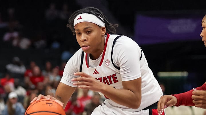 Nov 9, 2025; Charlotte, North Carolina, USA;  NC State Wolfpack guard Zoe Brooks (35) drives the ball against the Southern California Trojans during the second quarter of the Ally Tipoff game at Spectrum Center. Mandatory Credit: Cory Knowlton-Imagn Images