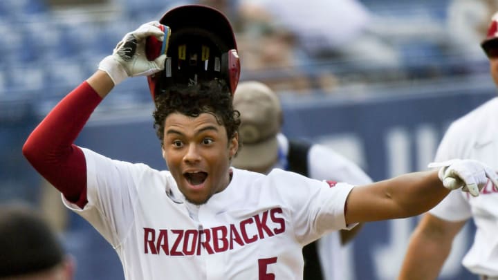 Arkansas batter Kendall Diggs celebrates after hitting the walk-off solo homer in extra innings to down Texas A&M Arkansas batter Kendall Diggs celebrates after hitting the walk-off solo homer in extra innings to down Texas A&M