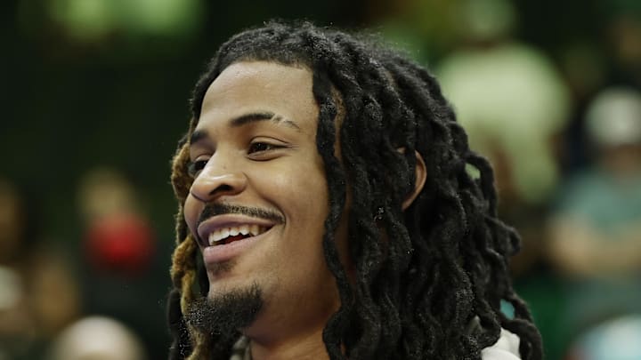 Memphis Grizzlies guard Ja Morant stands on the court following the game against the Charlotte Hornets.