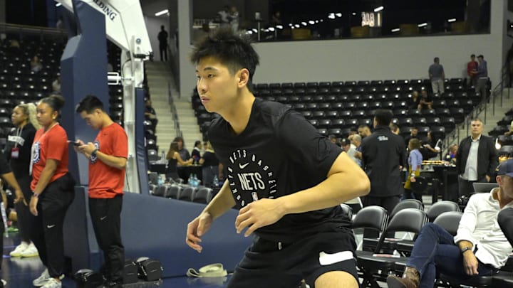 Oct 8, 2024; Oceanside, California, USA;  Brooklyn Nets guard Yongxi Cui (8) warms up prior to the preseason game against the Los Angeles Clippers at Frontwave Arena. Mandatory Credit: Jayne Kamin-Oncea-Imagn Images