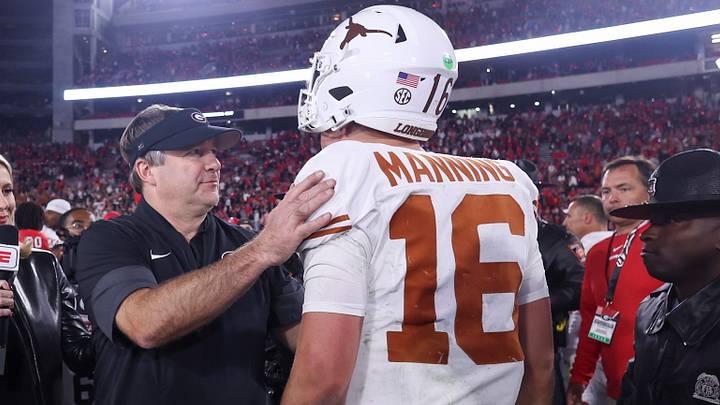 Georgia football coach Kirby Smart and Texas Longhorns quarterback Arch Manning (16) interact after a game at Sanford Stadium. Georgia football coach Kirby Smart and Texas Longhorns quarterback Arch Manning (16) interact after a game at Sanford Stadium.