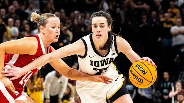 Iowa guard Caitlin Clark drives to the basket against Nebraska guard Callin Hake during the 2024 Big Ten Tournament.