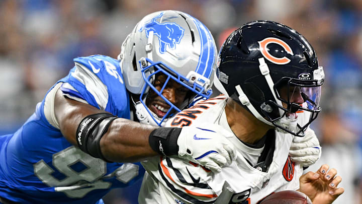 Detroit Lions DE Al-Quadin Muhammad (96) sacks Chicago Bears quarterback Caleb Williams (18) 