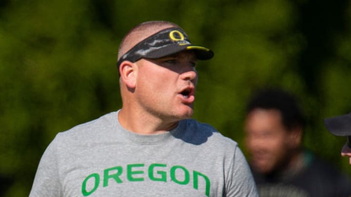 Oregon defensive coordinator Tosh Lupoi watches practice Wednesday Aug. 24, 2022 in Eugene, Ore.