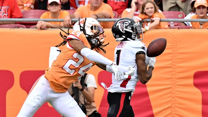 Oct 27, 2024; Tampa, Florida, USA; Tampa Bay Buccaneers defensive back Tyrek Funderbunk (24) breaks up a pass attempt to Atlanta Falcons wide receiver Darnell Mooney (1) in the first half at Raymond James Stadium. Mandatory Credit: Jonathan Dyer-Imagn Images