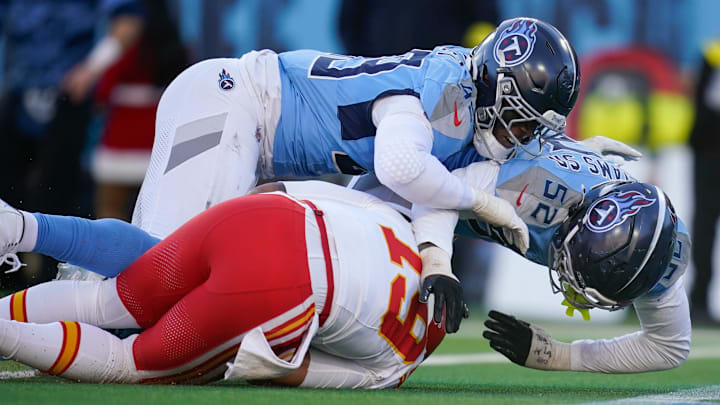 Tennessee Titans linebacker Arden Key (49) and linebacker James Williams Sr. (52) sack Kansas City Chiefs quarterback Chris Oladokun (19) during the fourth quarter at Nissan Stadium in Nashville, Tenn., Sunday, Dec. 21, 2025.