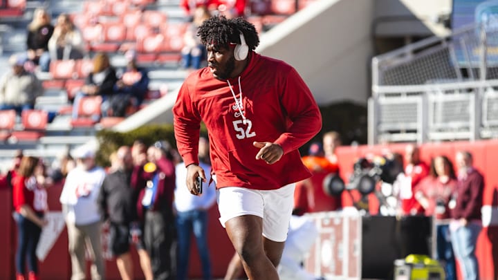 Nov 30, 2024; Tuscaloosa, Alabama, USA; Alabama Crimson Tide offensive lineman Tyler Booker (52) warms up before a game against the Auburn Tigers at Bryant-Denny Stadium. Mandatory Credit: Will McLelland-Imagn Images