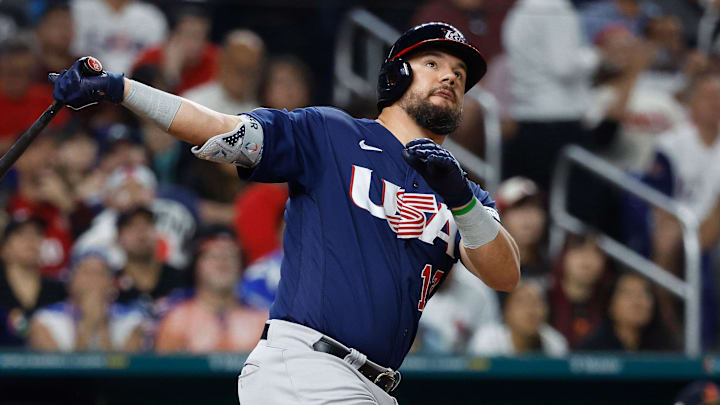 Mar 21, 2023; Miami, Florida, USA; USA designated hitter Kyle Schwarber (12) hits a home run against Japan in the eighth inning at LoanDepot Park. Mandatory Credit: Rhona Wise-Imagn Images