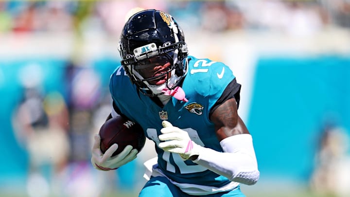Oct 12, 2025; Jacksonville, Florida, USA; Jacksonville Jaguars wide receiver Travis Hunter (12) runs the ball during the first half against the Seattle Seahawks at EverBank Stadium. Mandatory Credit: Morgan Tencza-Imagn Images