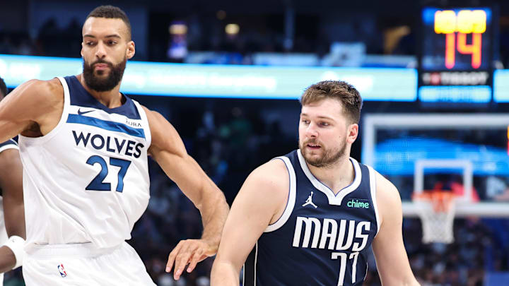 May 28, 2024; Dallas, Texas, USA; Dallas Mavericks guard Luka Doncic (77) dribbles against Minnesota Timberwolves center Rudy Gobert (27) during the third quarter of game four of the western conference finals for the 2024 NBA playoffs at American Airlines Center. Mandatory Credit: Kevin Jairaj-Imagn Images