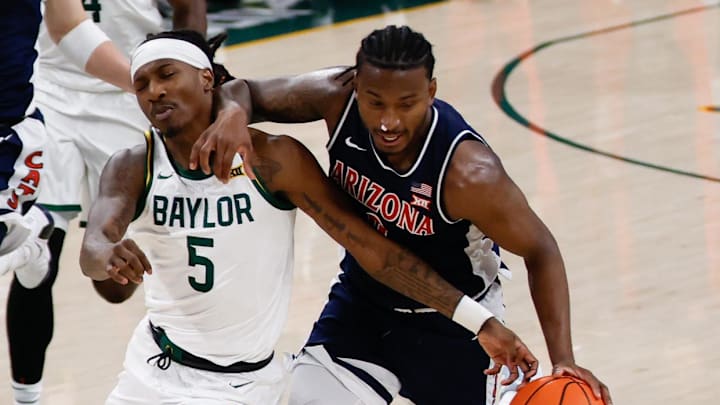 Feb 24, 2026; Waco, Texas, USA; Arizona Wildcats guard Jaden Bradley (0) is assessed a flagrant foul against Baylor Bears guard Obi Agbim (5) during the first half at Paul and Alejandra Foster Pavilion. Mandatory Credit: Chris Jones-Imagn Images Feb 24, 2026; Waco, Texas, USA; Arizona Wildcats guard Jaden Bradley (0) is assessed a flagrant foul against Baylor Bears guard Obi Agbim (5) during the first half at Paul and Alejandra Foster Pavilion. Mandatory Credit: Chris Jones-Imagn Images