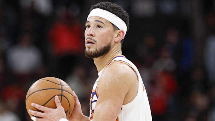 Apr 5, 2026; Chicago, Illinois, USA; Phoenix Suns guard Devin Booker (1) looks to pass the ball against the Chicago Bulls during the second half at United Center. Mandatory Credit: Kamil Krzaczynski-Imagn Images