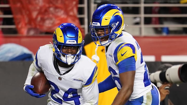 Dec 12, 2024; Santa Clara, California, USA; Los Angeles Rams cornerback Darious Williams (24) reacts with safety Kamren Kinchens (26) after intercepting a pass against the San Francisco 49ers in the fourth quarter at Levi's Stadium. Mandatory Credit: Cary Edmondson-Imagn Images
