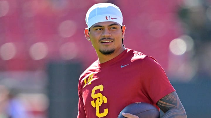 Oct 11, 2025; Los Angeles, California, USA;  USC Trojans quarterback Jayden Maiava (14) warms up prior to the game against the Michigan Wolverines at United Airlines Field at the Los Angeles Memorial Coliseum. Mandatory Credit: Jayne Kamin-Oncea-Imagn Images
