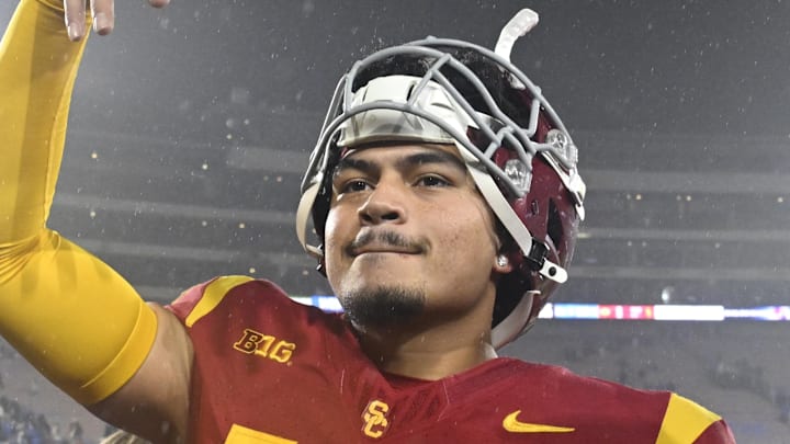 Nov 23, 2024; Pasadena, California, USA;  USC Trojans quarterback Jayden Maiava (14) celebrates the win over UCLA at Rose Bowl. Mandatory Credit: Robert Hanashiro-Imagn Images