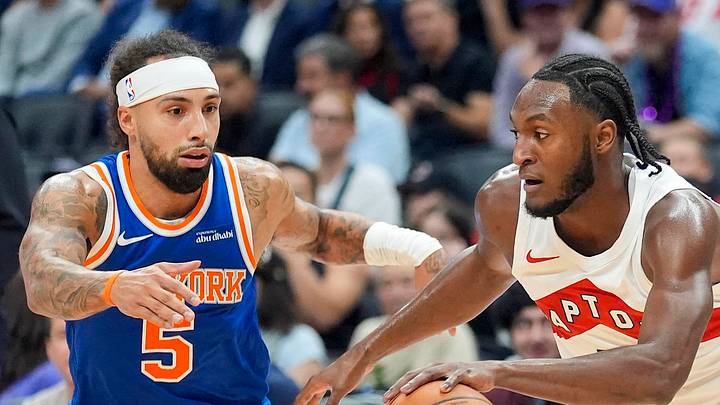 Toronto Raptors guard Immanuel Quickley dribbles the ball up court against New York Knicks guard Jose Alvarado. Toronto Raptors guard Immanuel Quickley dribbles the ball up court against New York Knicks guard Jose Alvarado.