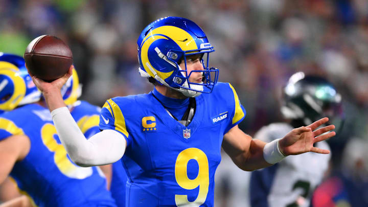 Dec 18, 2025; Seattle, Washington, USA; Los Angeles Rams quarterback Matthew Stafford (9) throws a pass against the Seattle Seahawks in overtime at Lumen Field. Mandatory Credit: Steven Bisig-Imagn Images