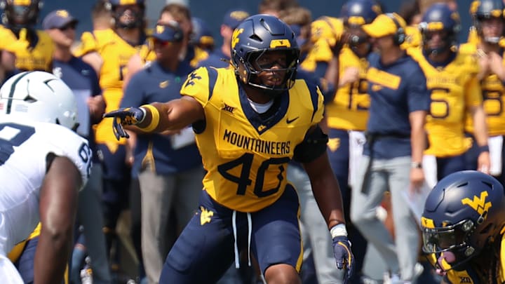 West Virginia University linebacker Josiah Trotter signals against Penn State. 