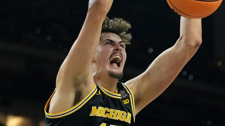 Apr 4, 2026; Indianapolis, IN, USA; Michigan Wolverines center Aday Mara (15) dunks against the Arizona Wildcats during the second half in a semifinal of the Final Four of the men's 2026 NCAA Tournament at Lucas Oil Stadium. Mandatory Credit: Bob Donnan-Imagn Images