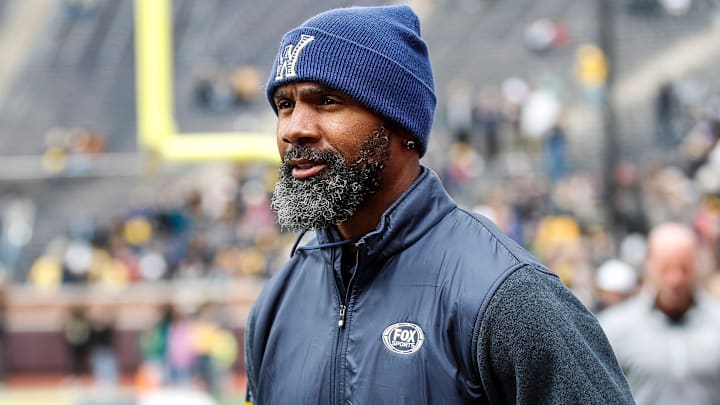 Michigan legend Charles Woodson waves at fans during warmup at the spring game at Michigan Stadium in Ann Arbor on Saturday, April 20, 2024. Michigan legend Charles Woodson waves at fans during warmup at the spring game at Michigan Stadium in Ann Arbor on Saturday, April 20, 2024.