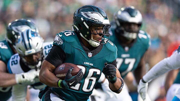 Dec 8, 2024; Philadelphia, Pennsylvania, USA;  Philadelphia Eagles running back Saquon Barkley (26) runs with the ball against the Carolina Panthers during the first quarter at Lincoln Financial Field. Mandatory Credit: Bill Streicher-Imagn Images