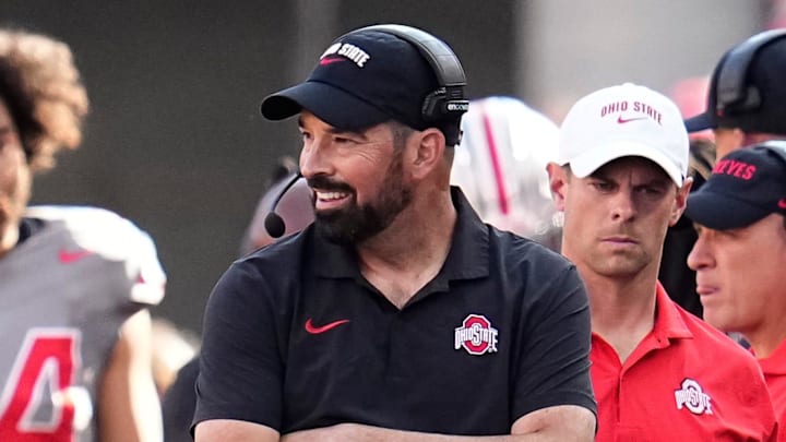 Oct 5, 2024; Columbus, OH, USA; Ohio State Buckeyes head coach Ryan Day smiles on the sideline during the first half of the NCAA football game against the Iowa Hawkeyes at Ohio Stadium.