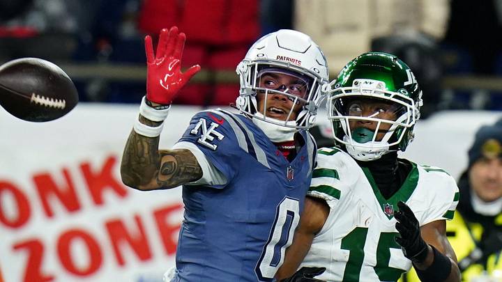 Nov 13, 2025; Foxborough, Massachusetts, USA; New England Patriots Christian Gonzalez cornerback (0) defends against New York Jets wide receiver Adonai Mitchell (15) in the fourth quarter at Gillette Stadium. Mandatory Credit: David Butler II-Imagn Images Nov 13, 2025; Foxborough, Massachusetts, USA; New England Patriots Christian Gonzalez cornerback (0) defends against New York Jets wide receiver Adonai Mitchell (15) in the fourth quarter at Gillette Stadium. Mandatory Credit: David Butler II-Imagn Images