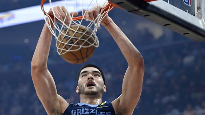 Nov 15, 2025; Cleveland, Ohio, USA; Memphis Grizzlies center Zach Edey (14) dunks in the first quarter against the Cleveland Cavaliers at Rocket Arena. Mandatory Credit: David Richard-Imagn Images