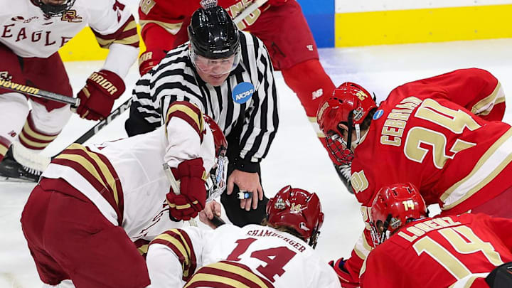 Apr 13, 2024; Saint Paul, Minnesota, USA; Boston College Eagles and Denver Pioneers players prepare for a faceoff during the first period of the championship game of the 2024 Frozen Four college ice hockey tournament at Xcel Energy Center. Apr 13, 2024; Saint Paul, Minnesota, USA; Boston College Eagles and Denver Pioneers players prepare for a faceoff during the first period of the championship game of the 2024 Frozen Four college ice hockey tournament at Xcel Energy Center.