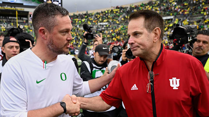 Oct 11, 2025; Eugene, Oregon, USA; Oregon Ducks head coach Dan Lanning shakes hands with Indiana Hoosiers head coach Curt Cignetti after Indiana defeated Oregon by the score of 30-20 at Autzen Stadium.