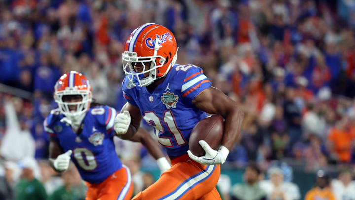 Dec 20, 2024; Tampa, FL, USA; Florida Gators running back KD Daniels (21) runs the ball in for a touchdown against the Tulane Green Wave during the second half at Raymond James Stadium. Mandatory Credit: Kim Klement Neitzel-Imagn Images Dec 20, 2024; Tampa, FL, USA; Florida Gators running back KD Daniels (21) runs the ball in for a touchdown against the Tulane Green Wave during the second half at Raymond James Stadium. Mandatory Credit: Kim Klement Neitzel-Imagn Images