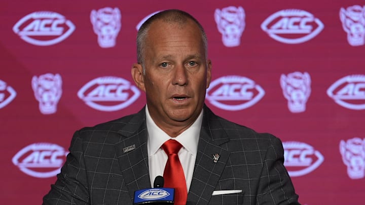 Jul 25, 2024; Charlotte, NC, USA;  North Carolina State Wolfpack head coach Dave Doeren speaks to the media during the ACC Kickoff at Hilton Charlotte Uptown. Mandatory Credit: Jim Dedmon-Imagn Images