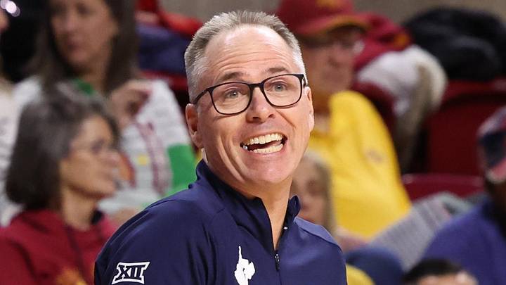 Jan 11, 2026; Ames, Iowa, USA; West Virginia Mountaineers head coach Mark Kellogg watches his team play the Iowa State Cyclones during the first half at James H. Hilton Coliseum. Mandatory Credit: Reese Strickland-Imagn Images