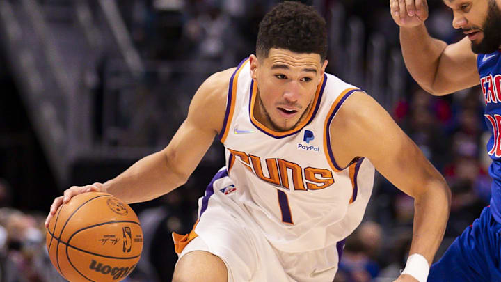 Jan 16, 2022; Detroit, Michigan, USA; Phoenix Suns guard Devin Booker (1) gets defended by Detroit Pistons guard Cory Joseph (18) during the third quarter at Little Caesars Arena. Mandatory Credit: Raj Mehta-Imagn Images Jan 16, 2022; Detroit, Michigan, USA; Phoenix Suns guard Devin Booker (1) gets defended by Detroit Pistons guard Cory Joseph (18) during the third quarter at Little Caesars Arena. Mandatory Credit: Raj Mehta-Imagn Images