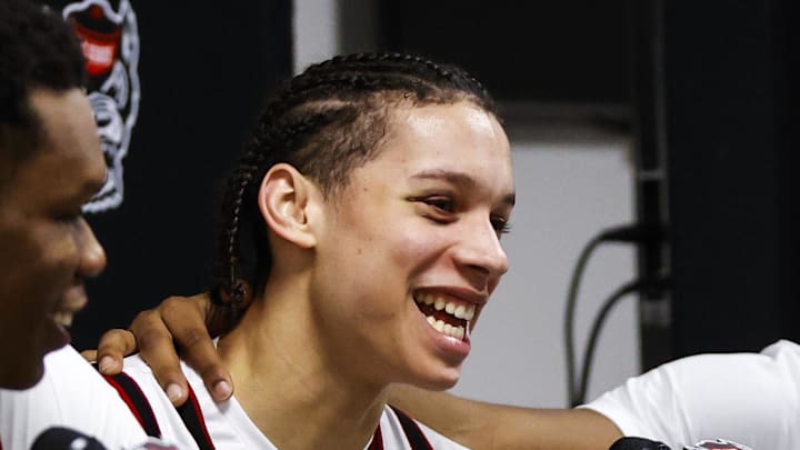 Dec 6, 2025; Raleigh, North Carolina, USA; NC State Wolfpack guard Quadir Copeland (11) gets emotional over guard Matt Able (3) praise for him during the presser of the game against the Liberty Flames at Lenovo Center. Mandatory Credit: Jaylynn Nash-Imagn Images