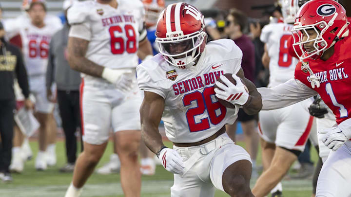 Jan 28, 2026; Mobile, AL, USA; American Team running back Kaelon Black (26) of Indiana runs the ball during American Senior Bowl practice at Hancock Whitney Stadium. 