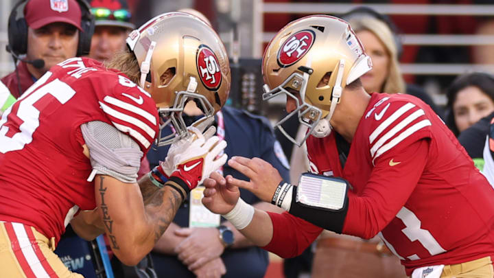 San Francisco 49ers tight end George Kittle (L) and quarterback Brock Purdy (R)
