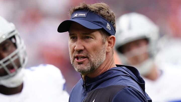 Oct 26, 2025; Denver, Colorado, USA; Dallas Cowboys head coach Brian Schottenheimer looks on before the game against the Denver Broncos at Empower Field at Mile High.