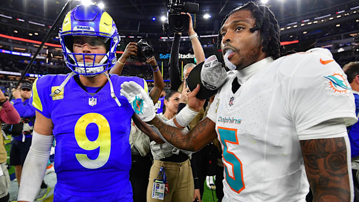 Nov 11, 2024; Inglewood, California, USA; Los Angeles Rams quarterback Matthew Stafford (9) meets with Miami Dolphins cornerback Jalen Ramsey (5) following the game at SoFi Stadium. Mandatory Credit: Gary A. Vasquez-Imagn Images
