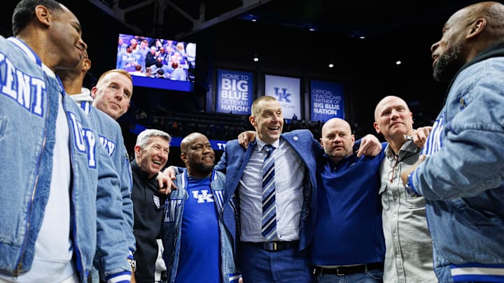 Feb 7, 2026; Lexington, Kentucky, USA; Kentucky Wildcats head coach Mark Pope huddles up with members of the 1996 National Championship team after the game against the Tennessee Volunteers at Rupp Arena at Central Bank Center. Mandatory Credit: Jordan Prather-Imagn Images