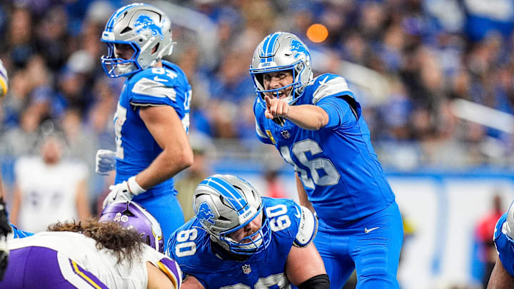 Detroit Lions quarterback Jared Goff (16) talks to center Graham Glasgow (60) before a play against Minnesota Vikings
