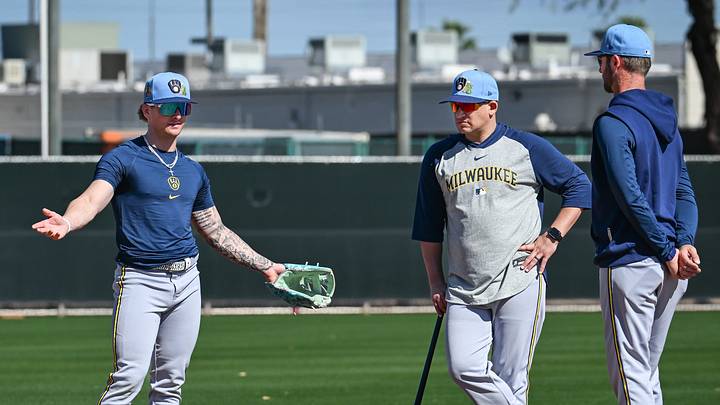 Milwaukee Brewers infielder/outfielder Jett Williams (76) works with Nashville Sounds bench coach David Tufo, center, and infield coordinator Andrew Romine at third base during spring training workouts Saturday, February 14, 2026, at American Family Fields of Phoenix in Phoenix, Arizona.