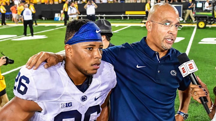 Sep 23, 2017; Iowa City, IA, USA; Penn State Nittany Lions running back Saquon Barkley (26) and head coach James Franklin talk with reporters after the game against the Iowa Hawkeyes at Kinnick Stadium. Penn State won 21-19. Mandatory Credit: Jeffrey Becker-Imagn Images