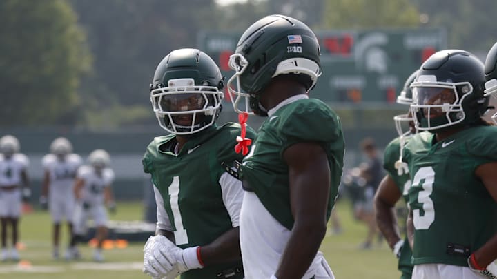 Nick Marsh (center) Omari Kelly (left)