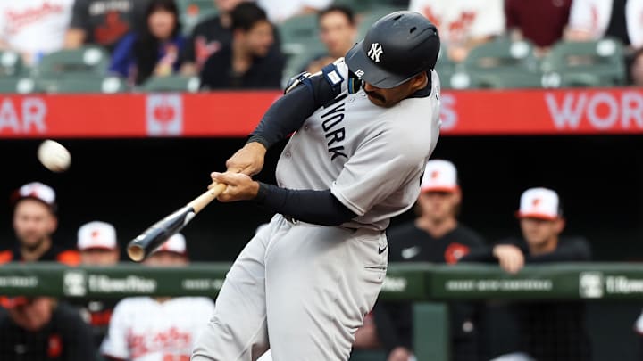Apr 29, 2025; Baltimore, Maryland, USA; New York Yankees outfielder Trent Grisham (12) hits a home run during the first inning against the Baltimore Orioles at Oriole Park at Camden Yards. Apr 29, 2025; Baltimore, Maryland, USA; New York Yankees outfielder Trent Grisham (12) hits a home run during the first inning against the Baltimore Orioles at Oriole Park at Camden Yards.